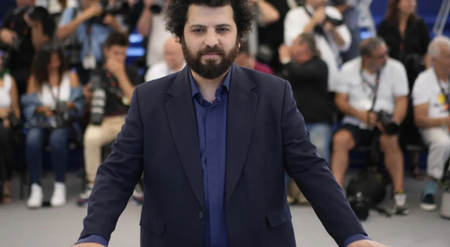 Director Saeed Roustayi poses for photographers at the photo call for the film "Leila's Brothers" at the 75th international film festival, Cannes, southern France, May 26, 2022. © Daniel Cole, AP
