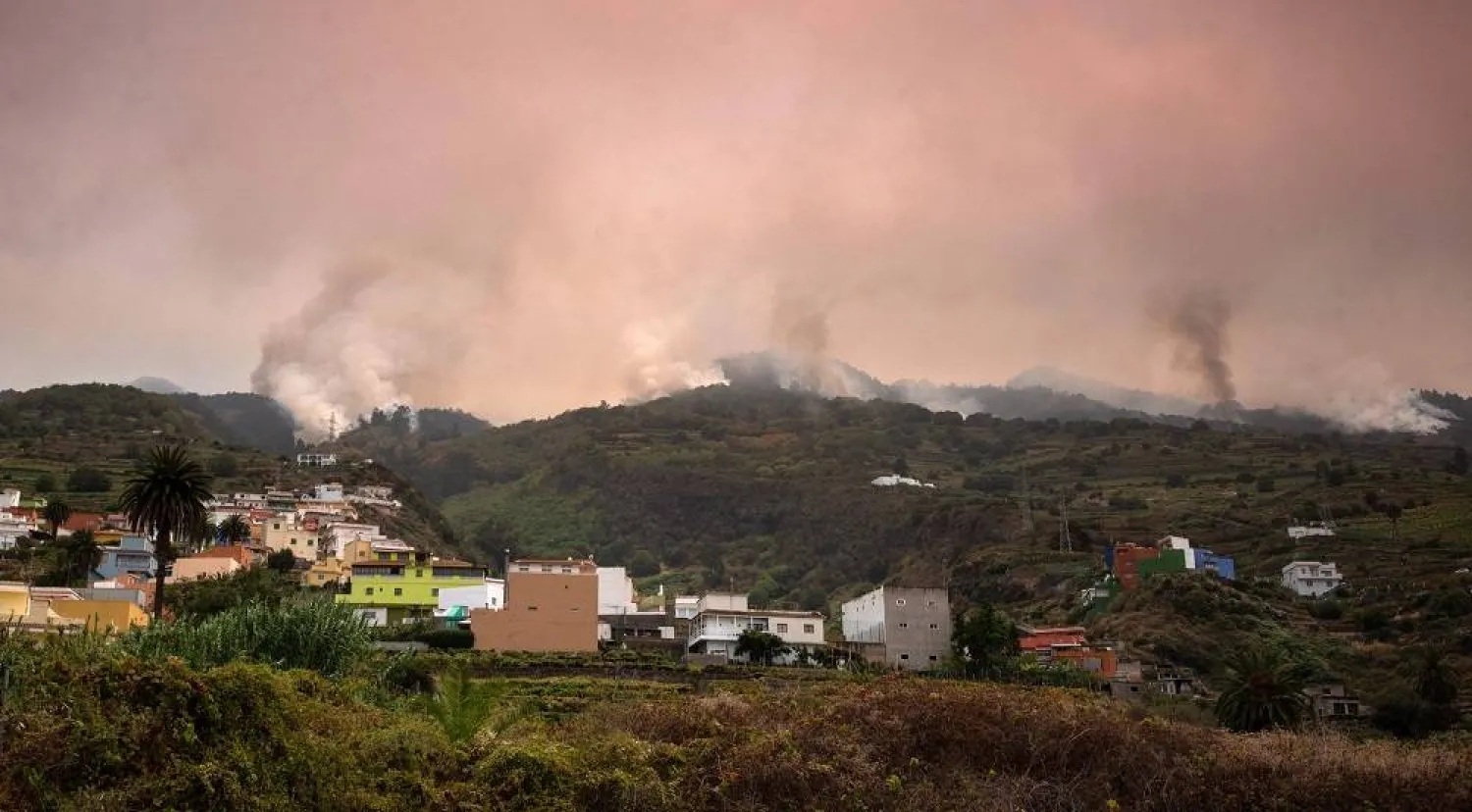 A wildfire rages out of control through forested slopes in La Matanza on the Canary island of Tenerife on August 19, 2023. (AFP)