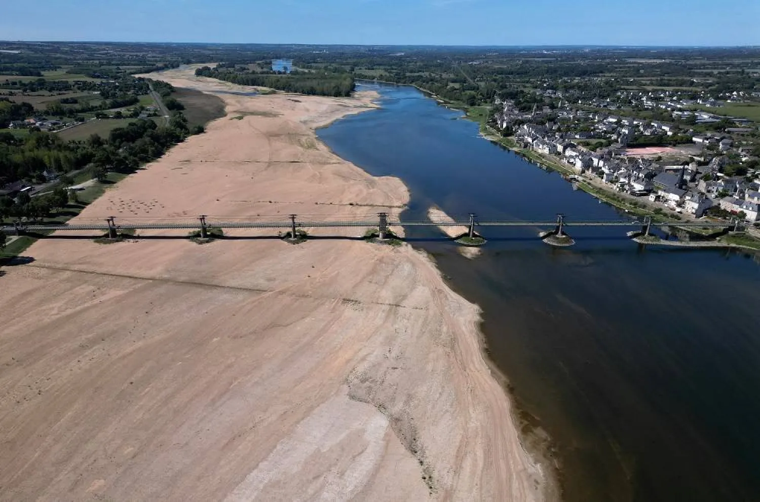  A view shows a bridge with sandbanks of the Loire River in Ingrandes-Le-Fresne-sur-Loire, France, August 21, 2023. (Reuters)
