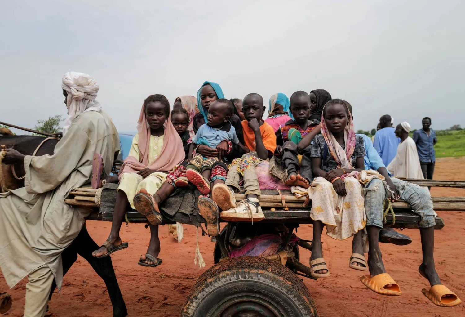 Sudanese children, who fled the conflict in Murnei in Sudan's Darfur region, ride a cart while crossing  the border between Sudan and Chad in Adre, Chad August 4, 2023. REUTERS/Zohra Bensemra 