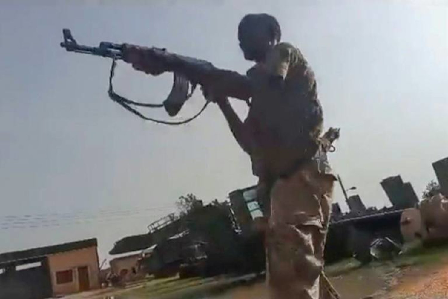 A grab from a UGC video posted on the X platform (formerly Twitter) on August 22, 2023 reportedly shows members of the Sudanese army firing at Rapid Support Forces (RSF) fighters in what they say is the Al-Shajara military base in Khartoum - AFP