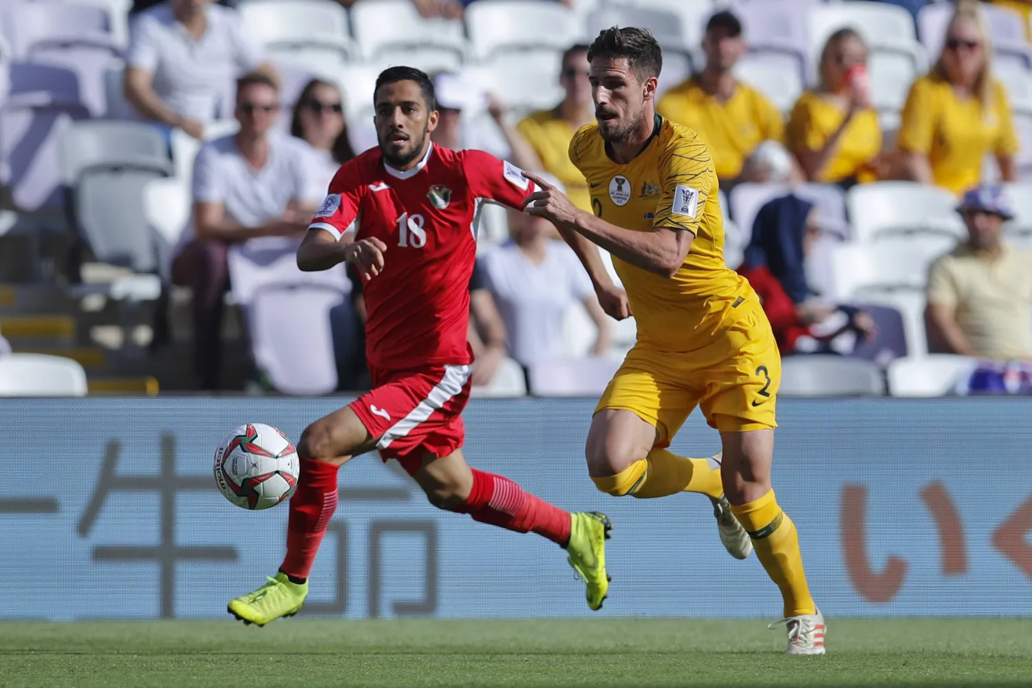 FILE - Jordan's midfielder Mousa Al Tamari, left, vies for the ball with Australia's defender Milos Degenek during the AFC Asian Cup group B soccer match between Australia and Jordan at Hazza bin Zayed stadium in Al Ain, United Arab Emirates, on Jan. 6, 2019. (AP Photo/Hassan Ammar, File)