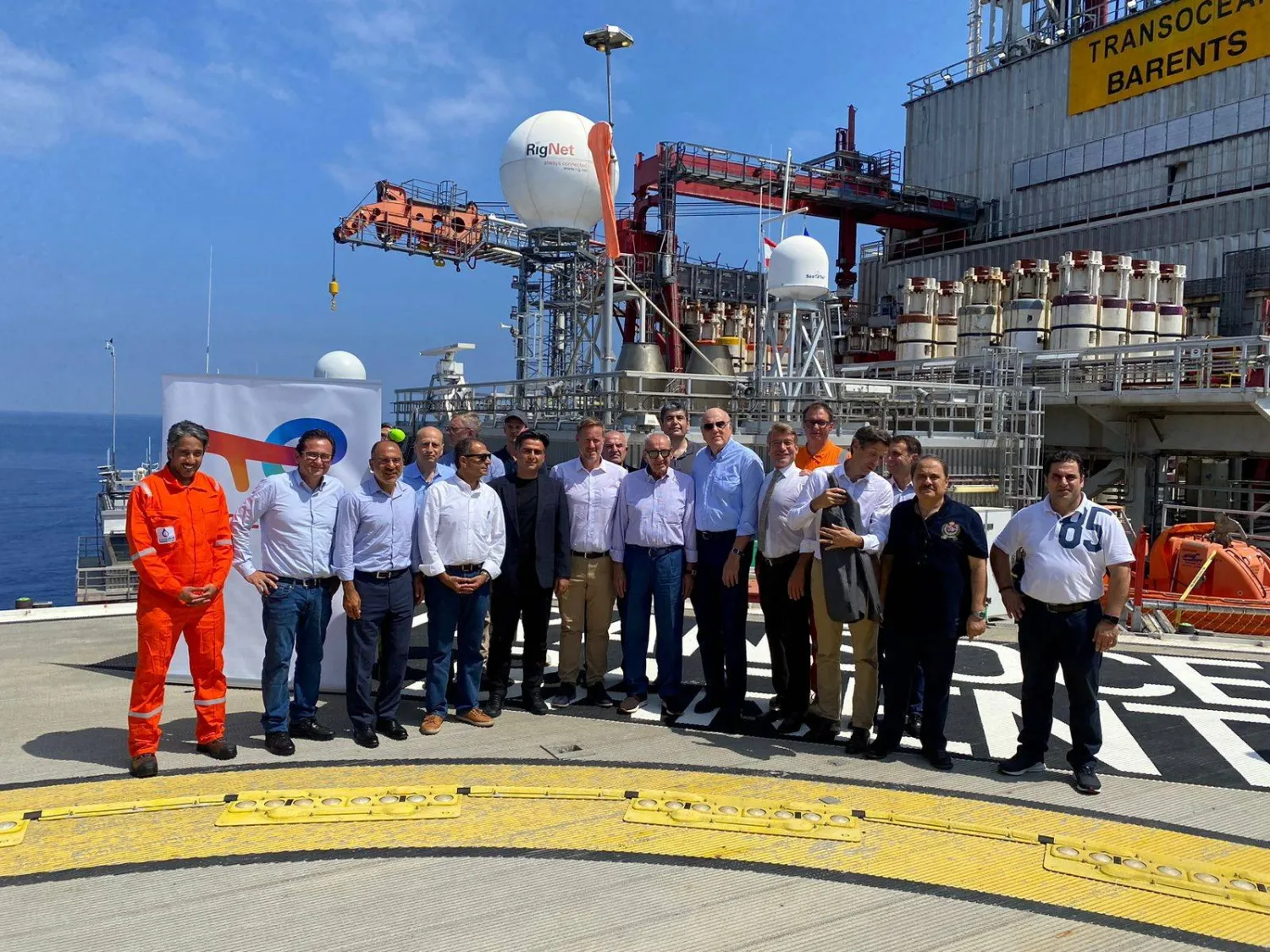 Lebanese Parliament Speaker Nabih Berri, Lebanon's caretaker Prime Minister Najib Mikati, Lebanon's caretaker Energy Minister Walid Fayad and Romain de La Martiniere of TotalEnergies pose for a picture along with others at TransOcean Barents drilling rig offshore Lebanon, in this handout released by Dalati Nohra, Lebanon August 22, 2023. Dalati Nohra/Handout via REUTERS 