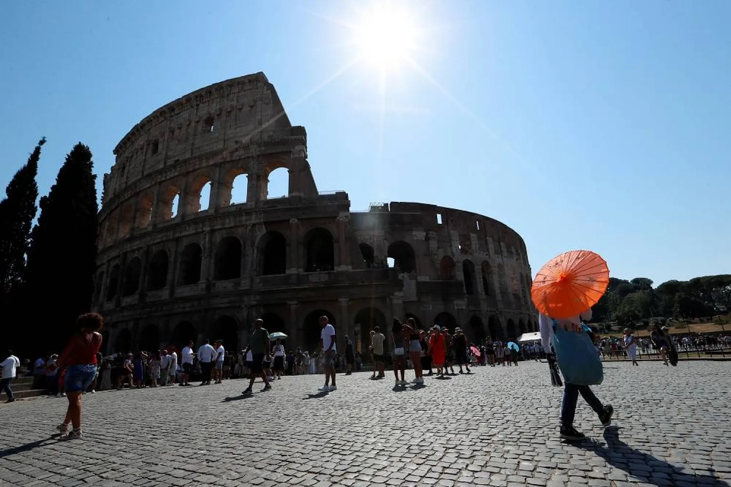 People walk near the Colosseum in Rome, Italy August 21, 2023. (Reuters)