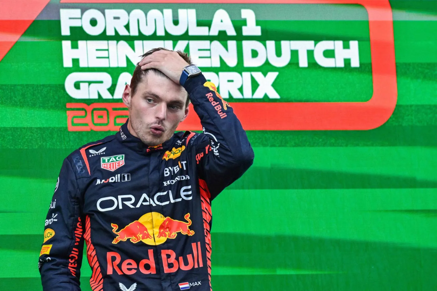 Red Bull Racing's Dutch driver Max Verstappen reacts as he celebrates on the podium after winning the Dutch Formula One Grand Prix race at The Circuit Zandvoort, in Zandvoort on August 27, 2023. (Photo by JOHN THYS / AFP)