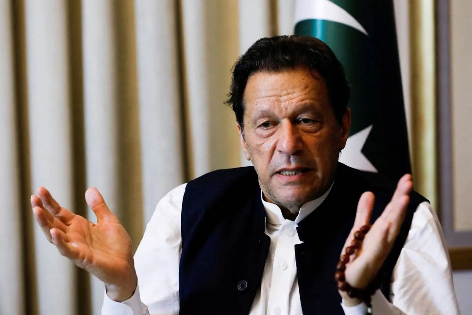 Former Pakistani Prime Minister Imran Khan, gestures as he speaks with Reuters during an interview, in Lahore, Pakistan March 17, 2023. (Reuters)