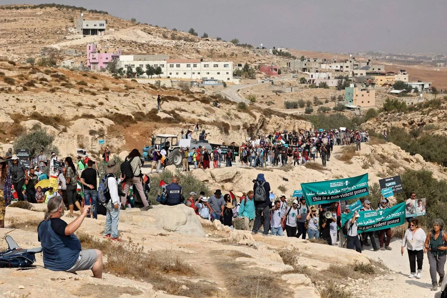 Palestinian and Israeli activists protest in the West Bank against the seizure of land and water supply cuts in Palestinian villages in October 2021. 