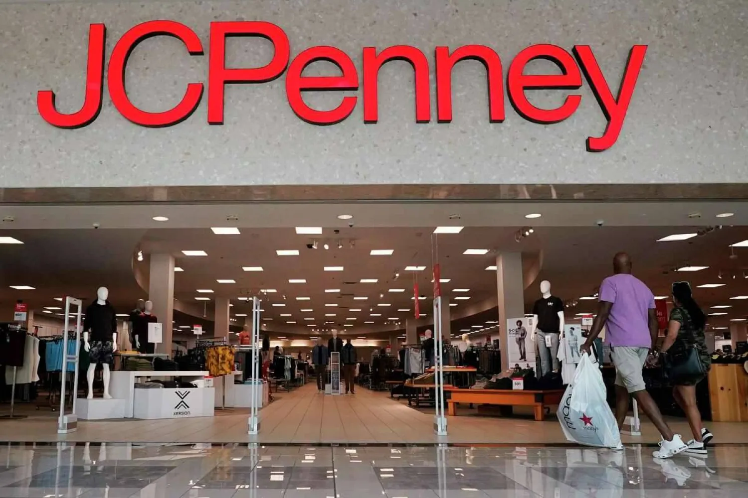 The JCPenney sign lights up the entrance to a store in Frisco, Texas, Wednesday, Aug. 30, 2023. LM Otero/AP