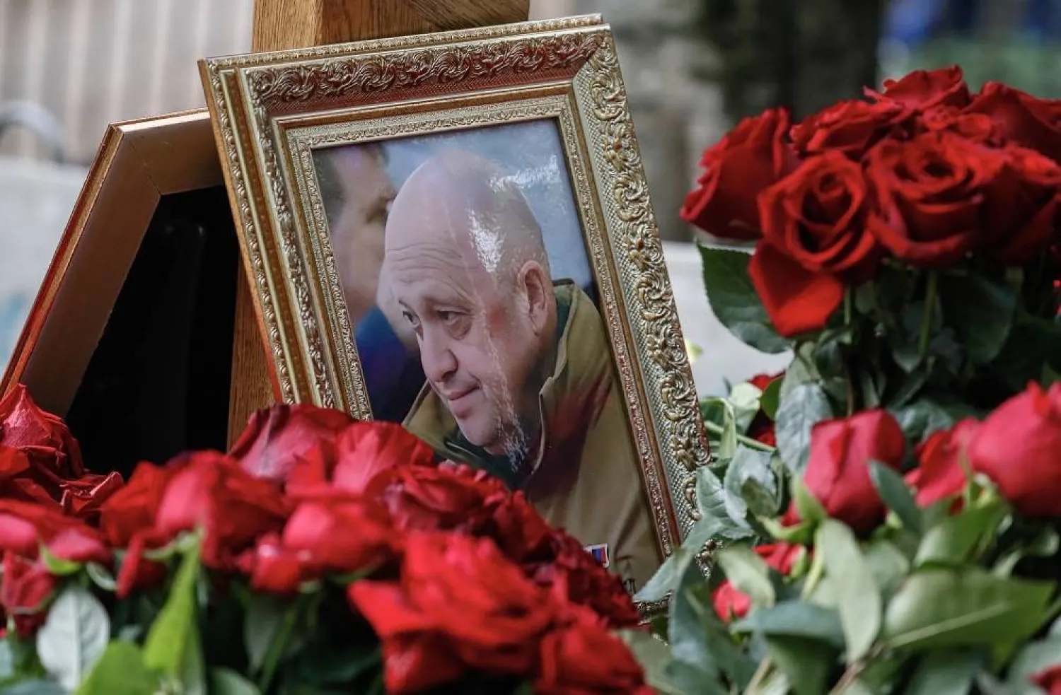 A portrait of PMC Wagner group chief Yevgeny Prigozhin sits on his grave at the Porokhov cemetery in St Petersburg, Russia, 30 August 2023. (EPA)