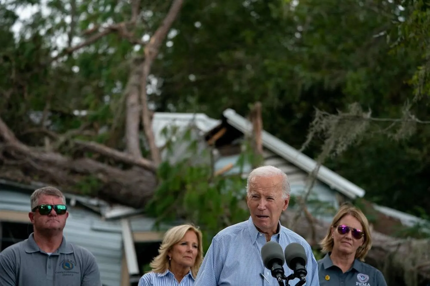  US President Joe Biden speaks in front of a home destroyed by fallen trees and debris during a tour of communities impacted by Hurricane Idalia, in Live Oak, Florida, on September 2, 2023. (AFP)
