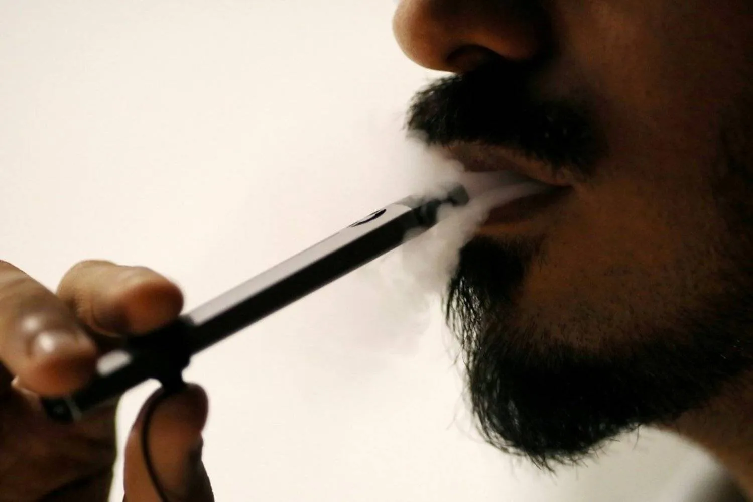 File photo: man smokes an e-cigarette at a cafe in Dubai. Photo: Reuters

