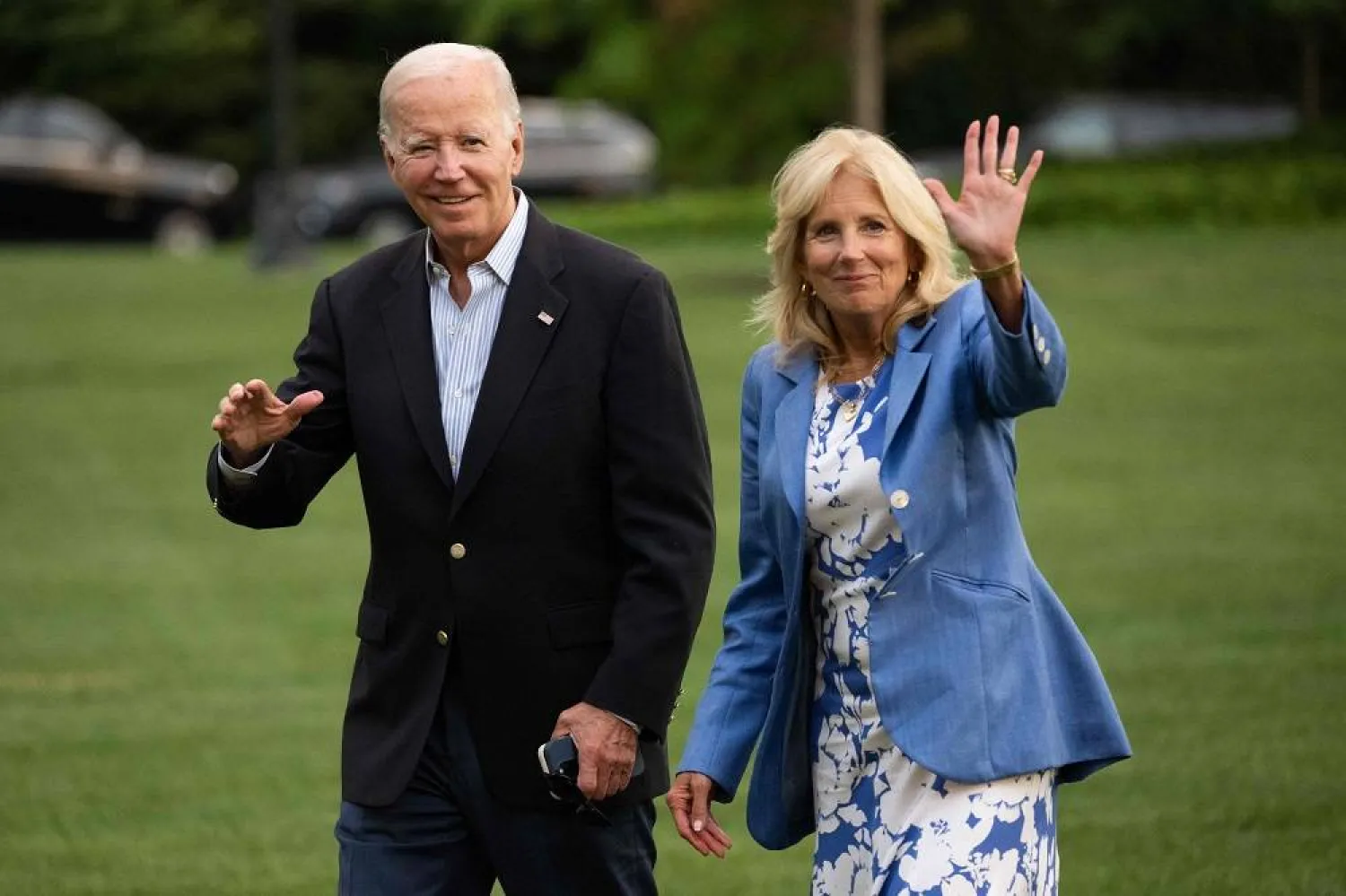  US President Joe Biden and First Lady Jill Biden walk to the White House upon arrival on the South Lawn in Washington, DC, August 26, 2023, following a week long vacation in Lake Tahoe, Nevada. (AFP)