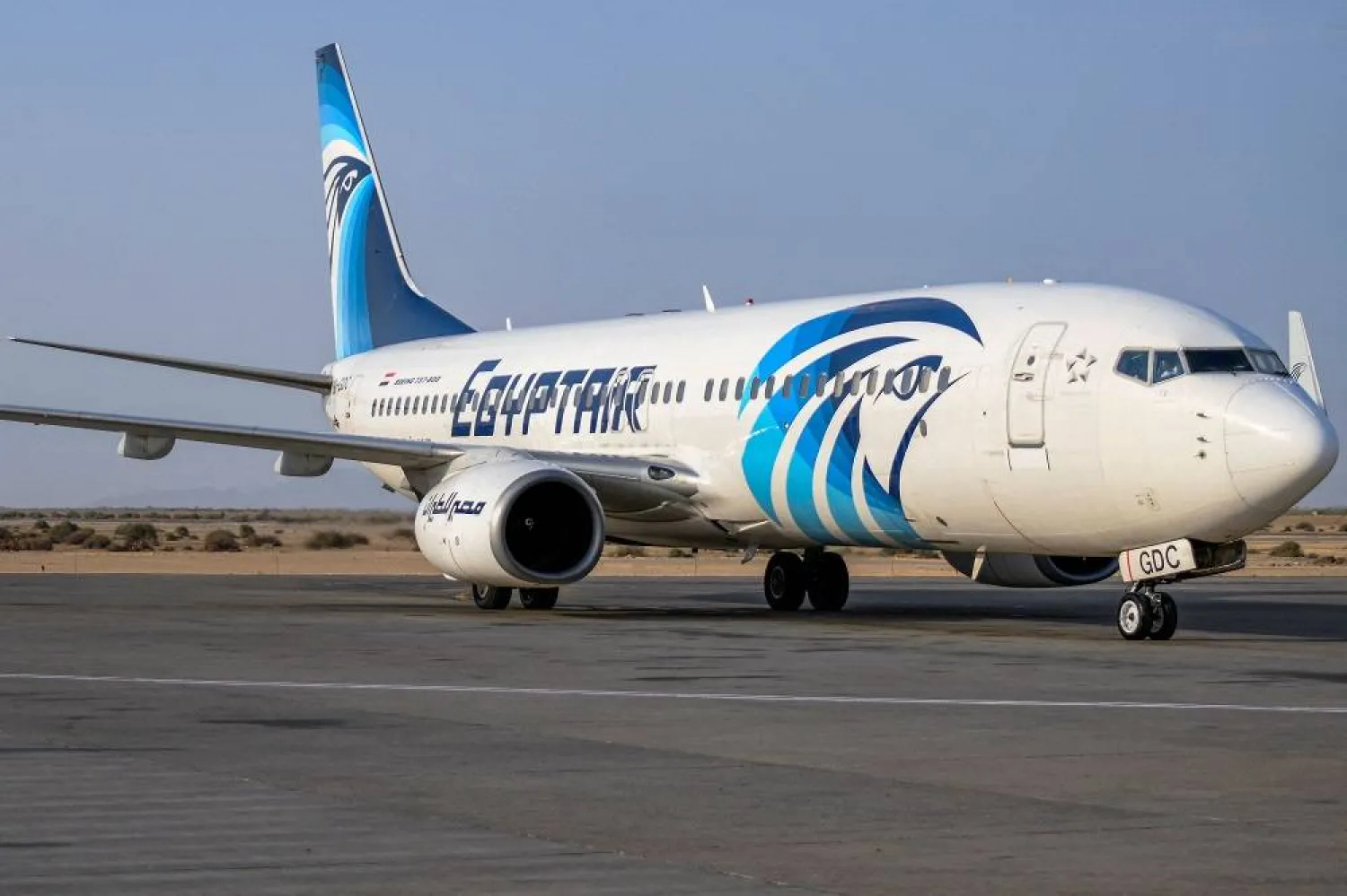 An EgyptAir Boeing 737 aircraft is pictured on the tarmac upon landing for the first time at Port Sudan International Airport on September 5, 2023 to inaugurate a new international flight route between Cairo and Port Sudan. (AFP)