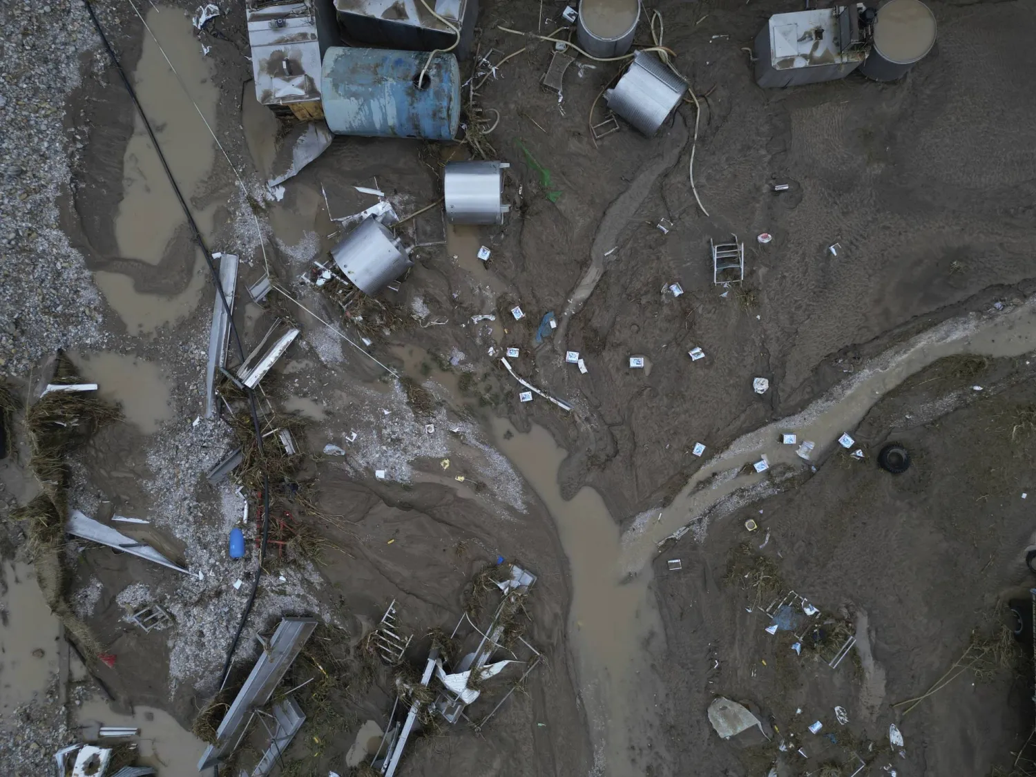 Floodwaters and mud cover the land after the country's record rainstorm, in the village of Nea Lefki, in Thessaly region, central Greece, Wednesday, Sept. 6, 2023. (AP Photo/Vaggelis Kousioras)