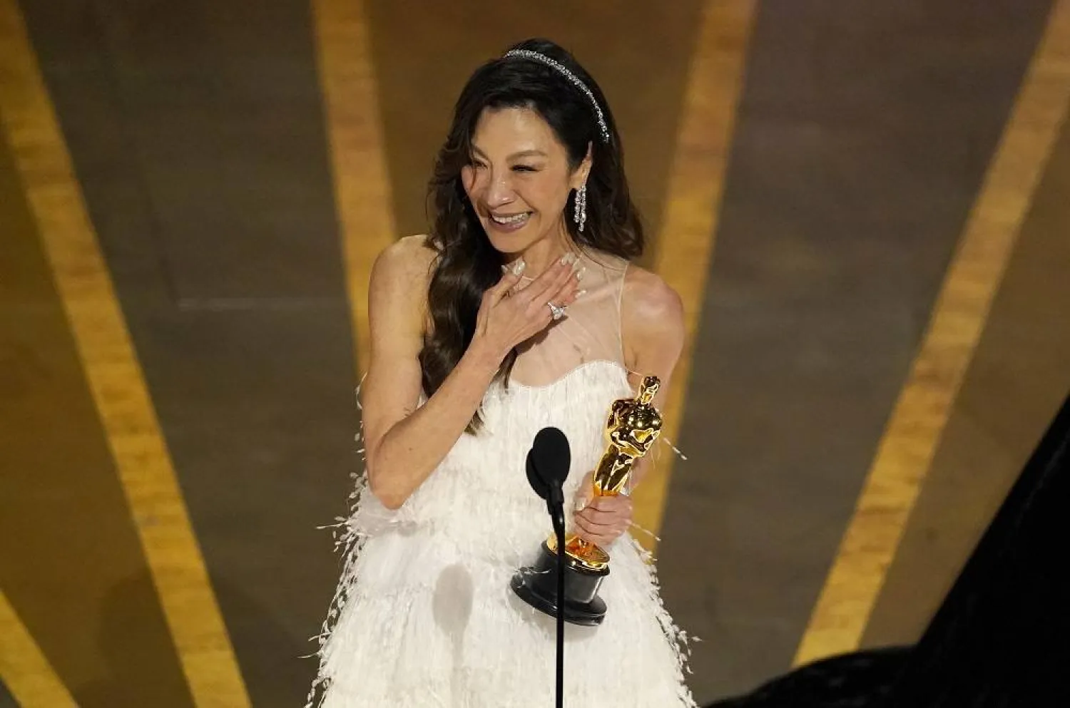 Michelle Yeoh accepts the award for best performance by an actress in a leading role for "Everything Everywhere All at Once" at the Oscars on March 12, 2023, in Los Angeles. (AP)