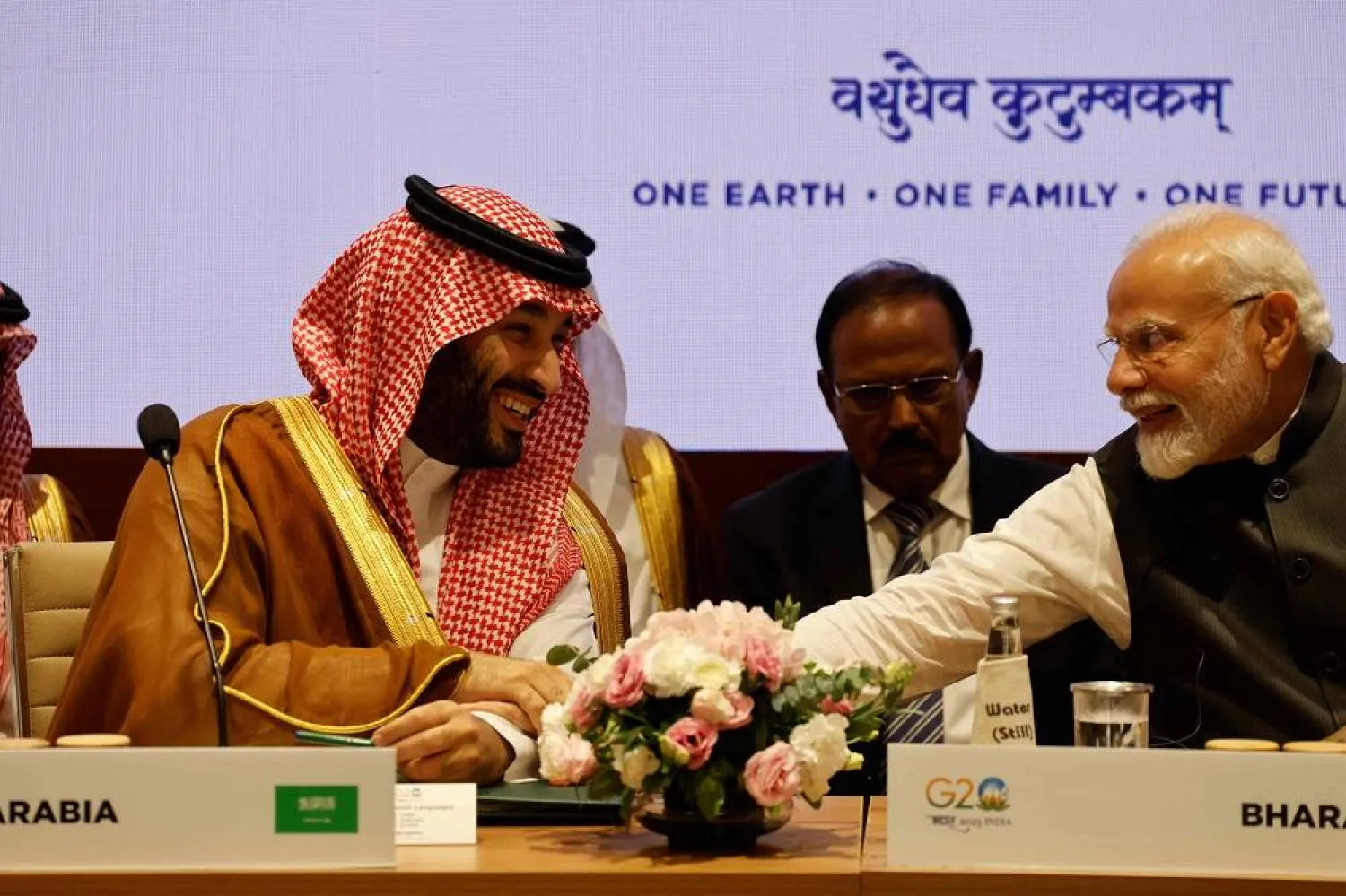 India's Prime Minister Narendra Modi (R) and Saudi Arabia's Crown Prince and Prime Minister Mohammed bin Salman speak during a session as part of the G20 Leaders' Summit at the Bharat Mandapam in New Delhi on September 9, 2023. (AFP) 