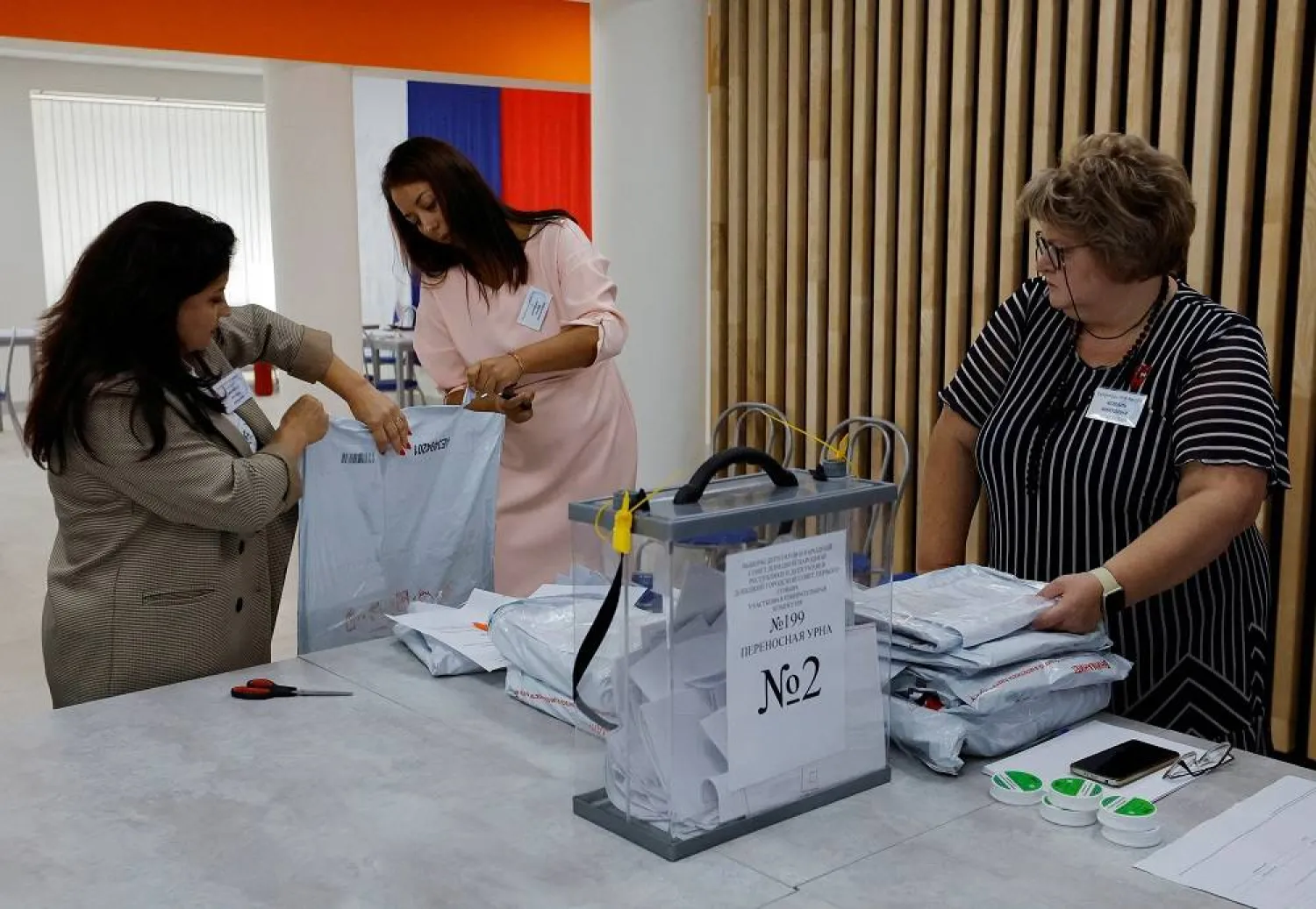 Members of an electoral commission prepare ballots for counting at a polling station during local elections held by the Russian-installed authorities in the course of Russia-Ukraine conflict in Donetsk, Russian-controlled Ukraine, September 10, 2023. (Reuters)