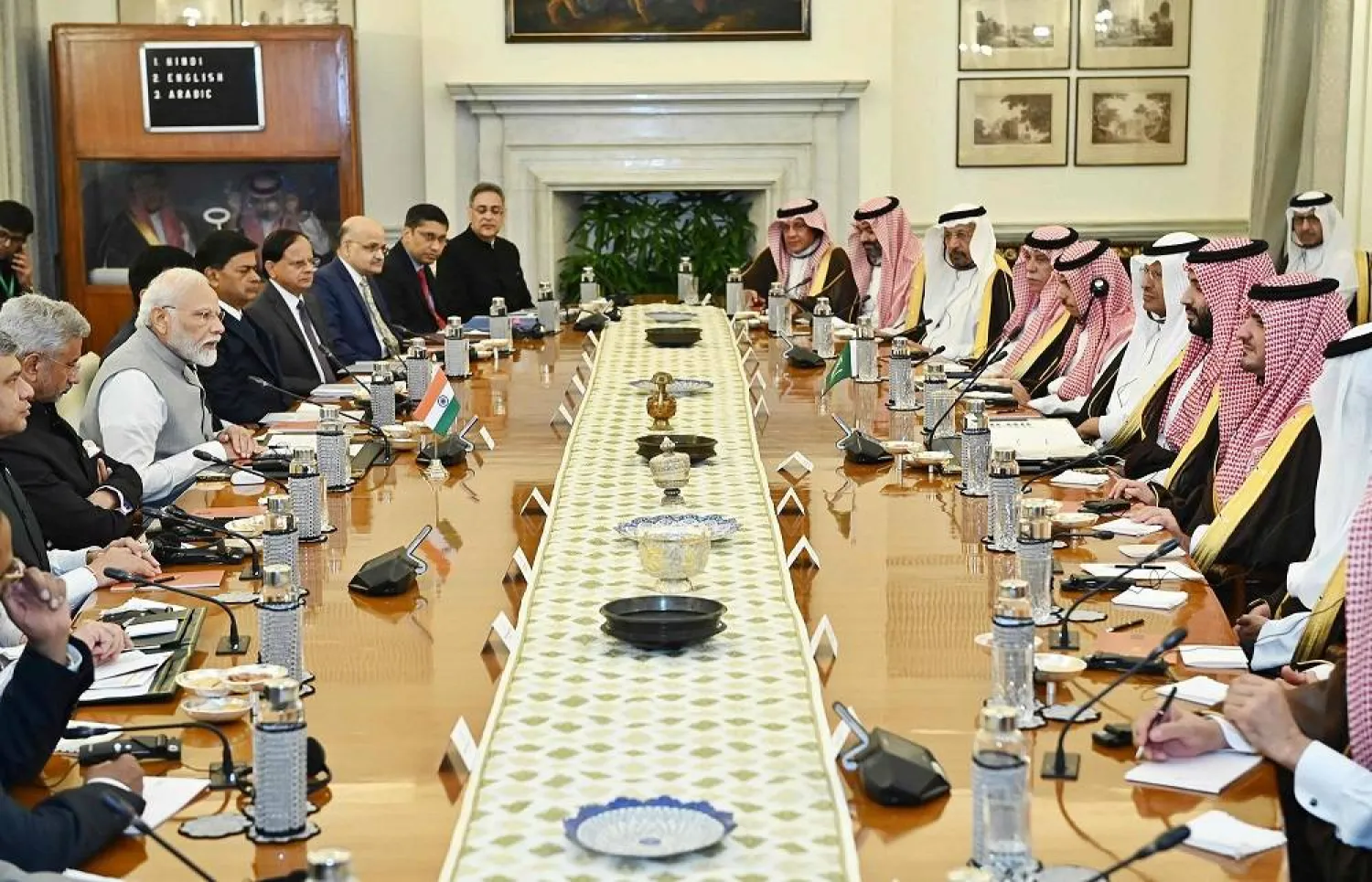 This handout photograph taken on September 11, 2023 and released by the Indian Press Information Bureau (PIB) shows India's Prime Minister Narendra Modi (center L) and his Saudi Arabian counterpart and Crown Prince Mohammed bin Salman (center R) attending their delegation level talks at the Hyderabad House in New Delhi. (Indian Press Information Bureau (PIB) / AFP)  