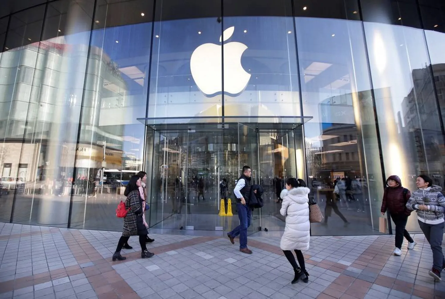 People walk outside an Apple store in Beijing, China December 12, 2018. (Reuters)