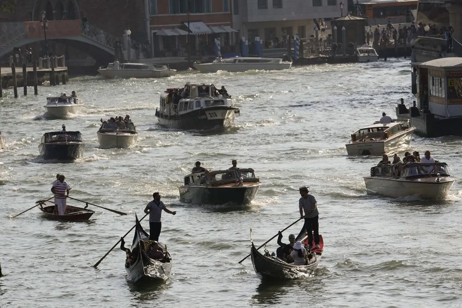 A view of boats and gondolas on a canal, in Venice, Italy, Wednesday, Sept. 13, 2023. (AP)