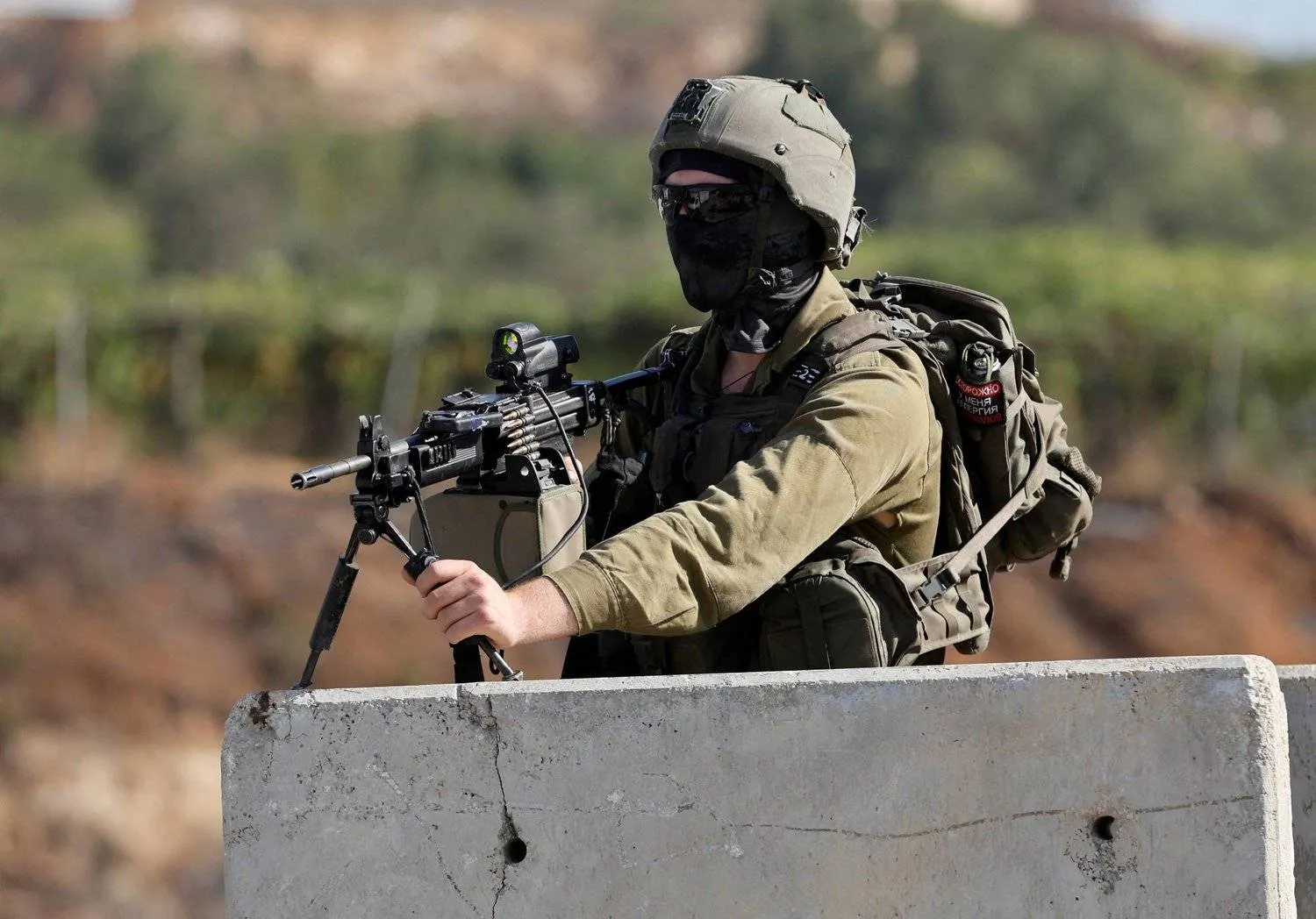 An Israeli soldier at a crossing in Hebron in the West Bank on August 22, 2023. (Reuters) 

