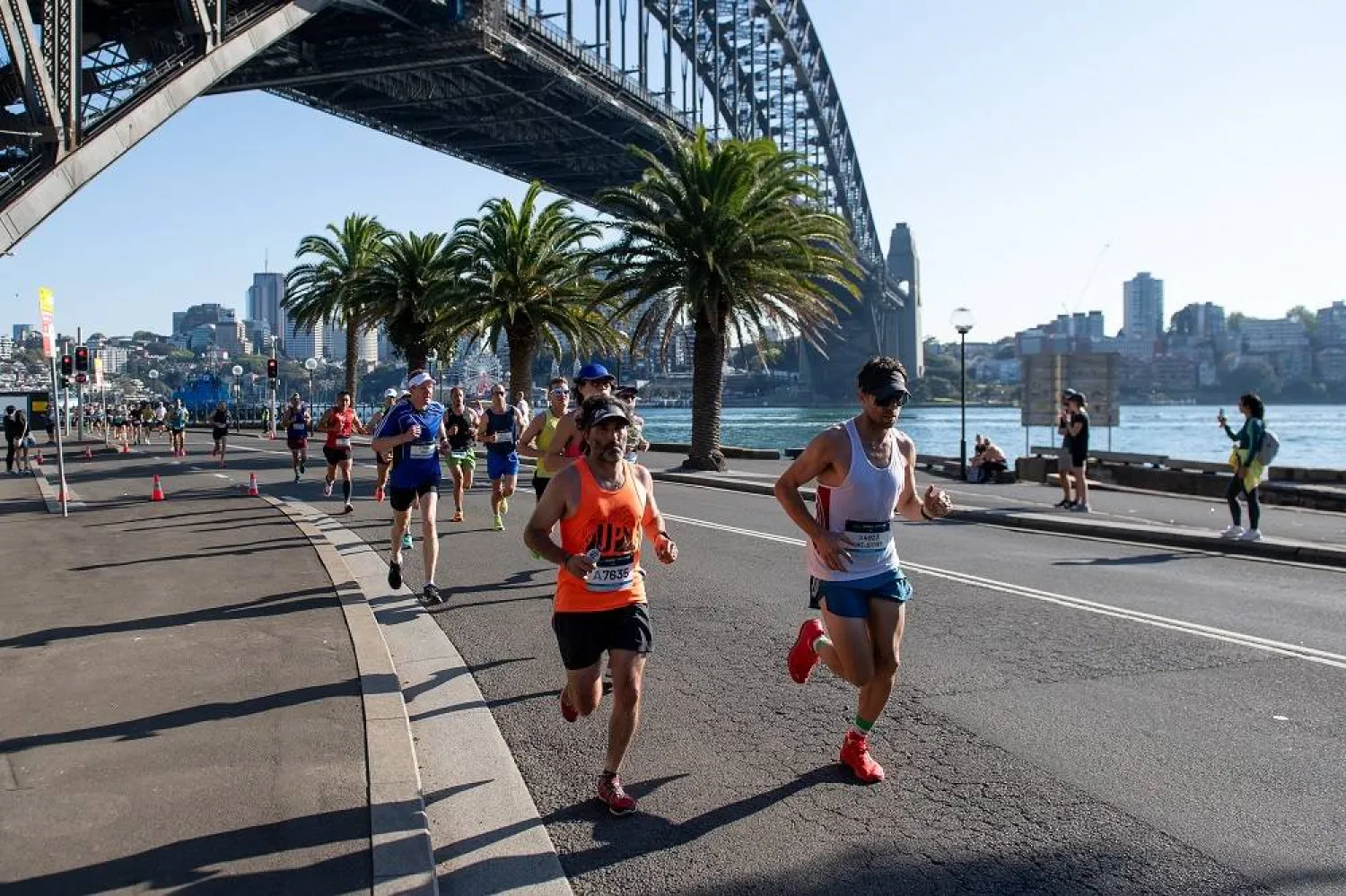 Marathon participants run through The Rocks during the 2023 Sydney Marathon in Sydney, Australia, 17 September 2023. (EPA)