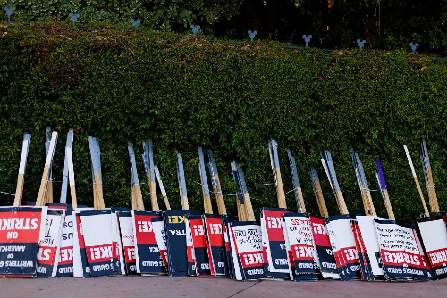 Strike signs await striking SAG-AFTRA actors and Writers Guild of America (WGA) outside Disney Studios in Burbank, California, US, July 25, 2023. (Reuters)