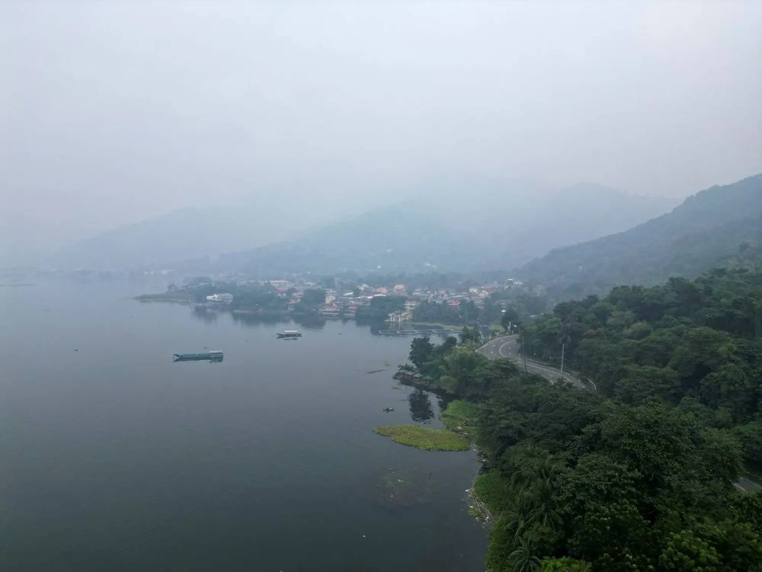 An aerial view shows smog enveloping the coastal town of Talisay in Batangas Province, Philippines, September 22, 2023. (Reuters)