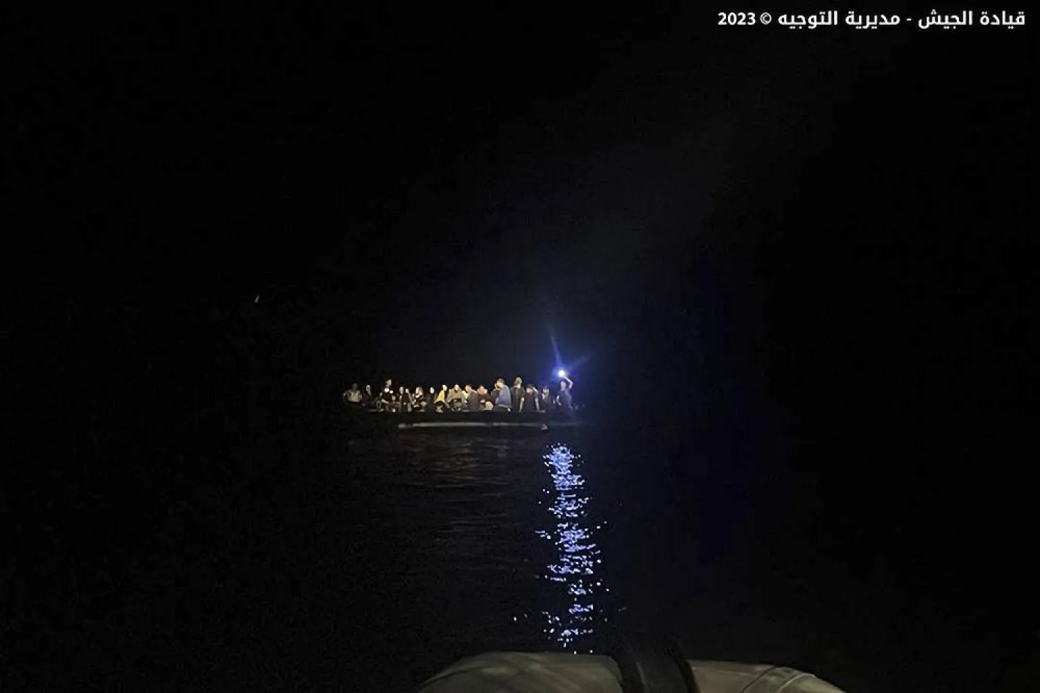 This photo released on Saturday, Sept. 23, 2023, by the Lebanese Army official website, shows a rubber boat with migrants during a rescue operation at the Mediterranean Sea, near the shores of the northern coastal town of Chekka, Lebanon. (Lebanese Army website via AP) 