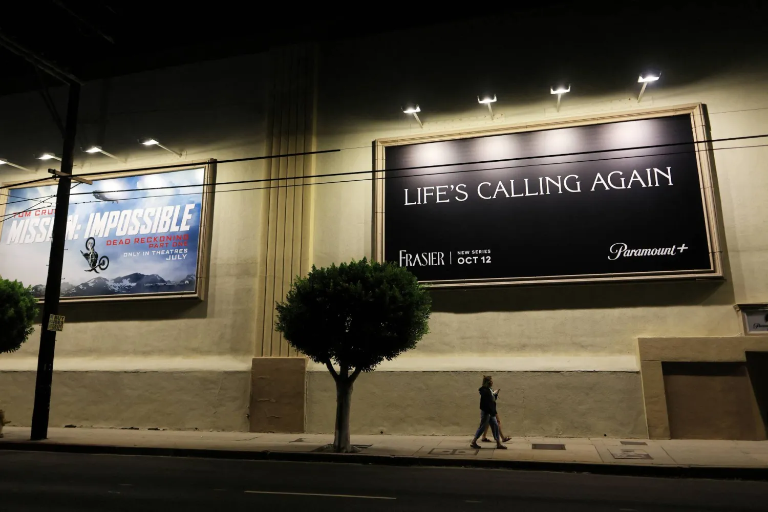 People walk outside Paramount Studios after the Writers Guild of America (WGA) said it reached a preliminary labor agreement with major studios in Los Angeles, California, US, September 24, 2023.  REUTERS/David Swanson
