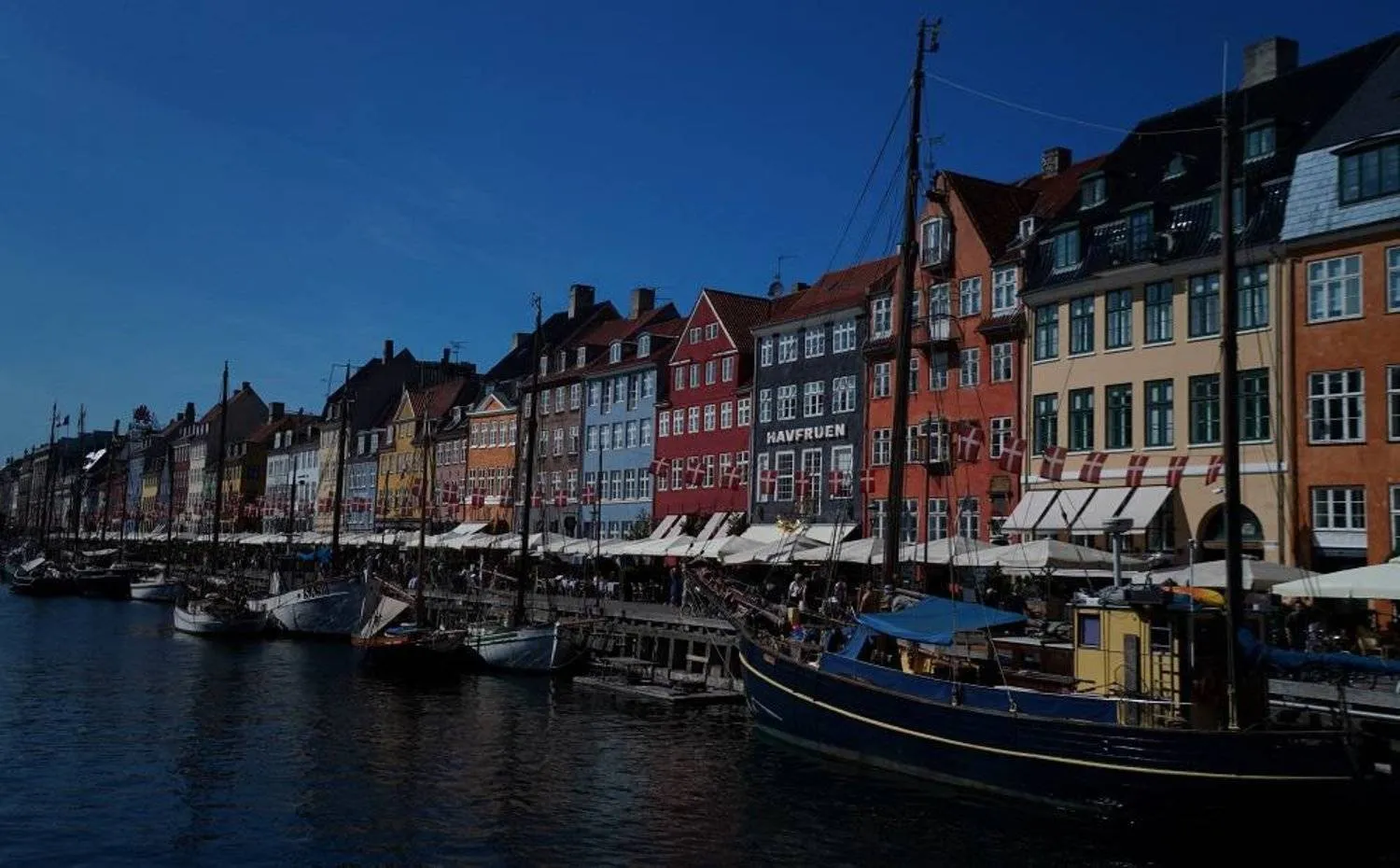 File: Tourists and visitors enjoy a warm sunny day in the historic Nyhavn area of Copenhagen, Denmark, July 9, 2023. (Reuters)
