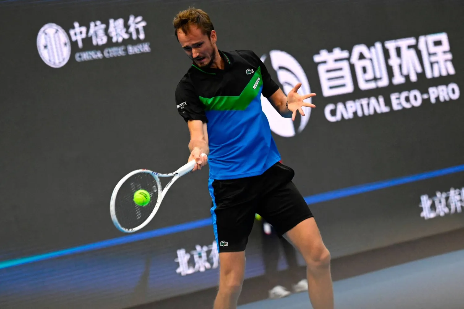 Russia's Daniil Medvedev hits a return to Australia's Alex De Minaur during their men's singles second round tennis match at the China Open tennis tournament in Beijing on September 30, 2023. (Photo by Jade Gao / AFP)