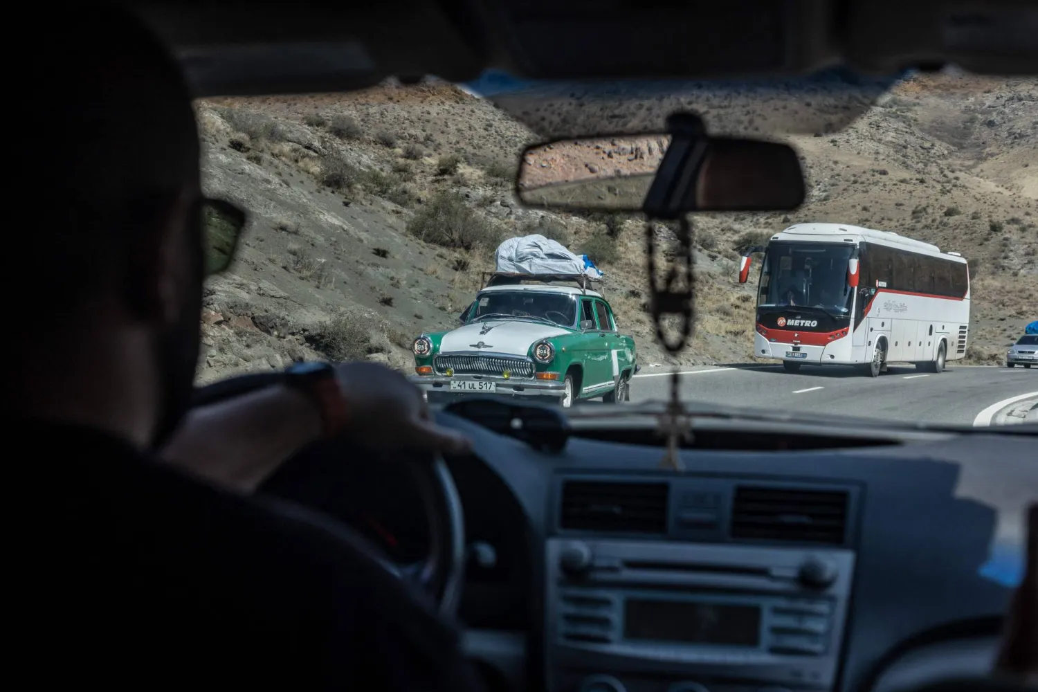 Armenian refugees from Nagorno-Karabakh travel in a car loaded with their belongings on the road between Goris and Yerevan on September 30, 2023. (Photo by Diego Herrera Carcedo / AFP)