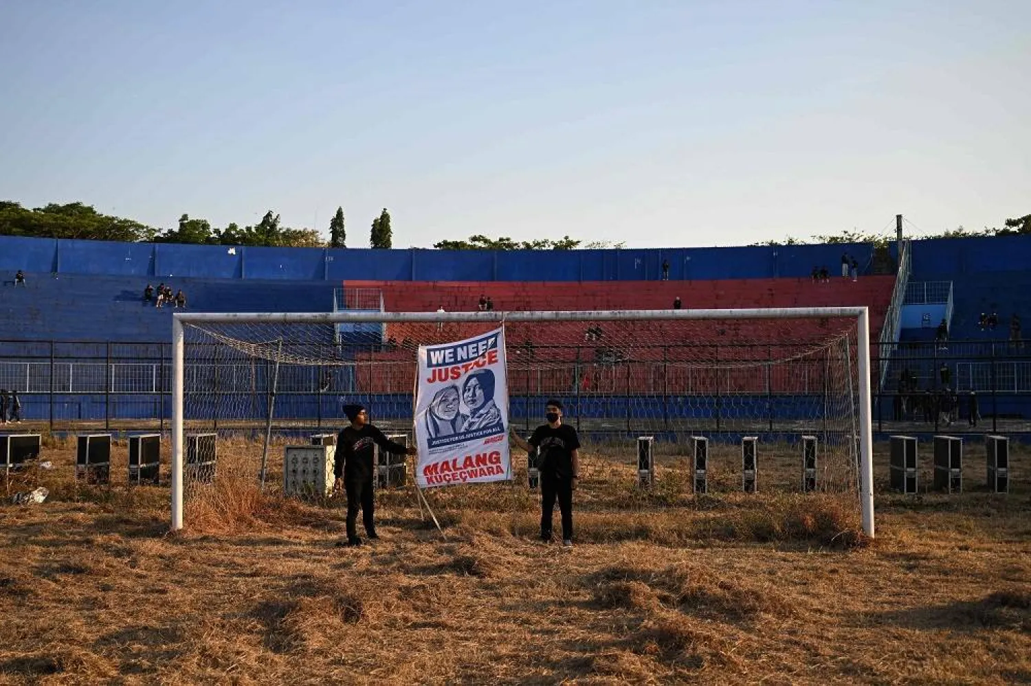 Protesters react before a memorial service on the first anniversary of the October 2022 stampede that killed 135 people in one of football's worst tragedies at the Kanjuruhan football stadium in Malang, East Java, on October 1, 2023. (AFP)