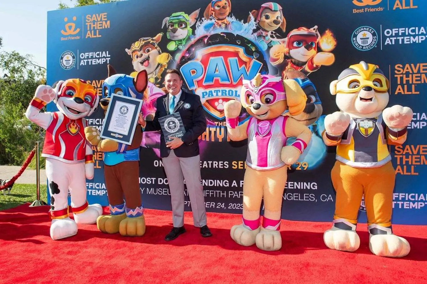 Guinness World Records Adjudicator Michael Empric holds a certificate during the Guinness World Record Breaking Screening in support of "PAW Patrol: The Mighty Movie" at the Autry Museum of the American West in Los Angeles, California, on September 24, 2023. (AFP)