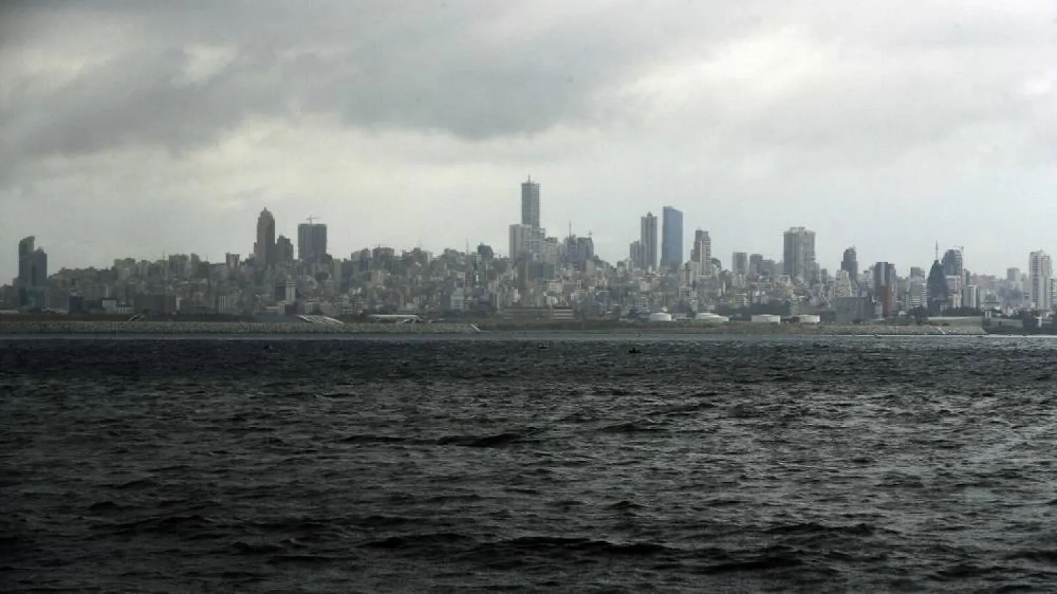 A picture taken from the seaside promenade of the northern Lebanese coastal town of Dbayeh shows the skyline of the Lebanese capital Beirut on March 17, 2020. (AFP)