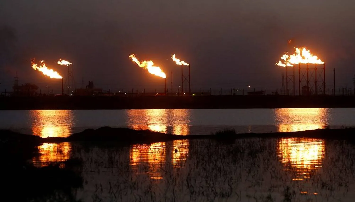 lames emerge from flare stacks at Nahr Bin Umar oil field, north of Basra, Iraq March 9, 2020. (Reuters)