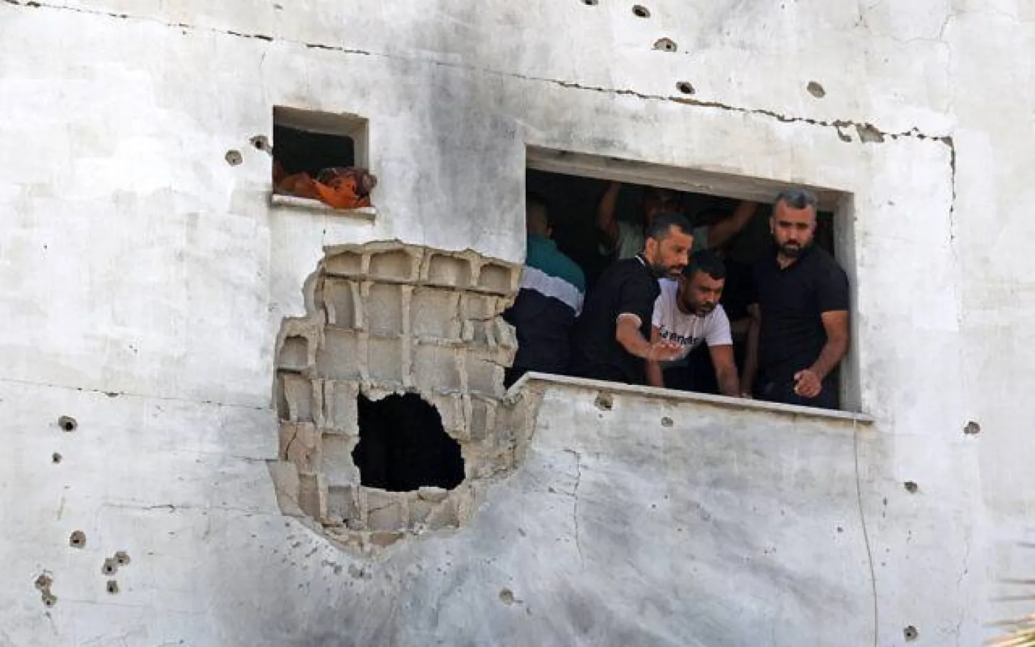 Palestinians inspect a damaged house following an Israel military raid in the Palestinian town of Aqaba, near Tubas in the West Bank, on September 1, 2023. (Jaafar Ashtiyeh / AFP)