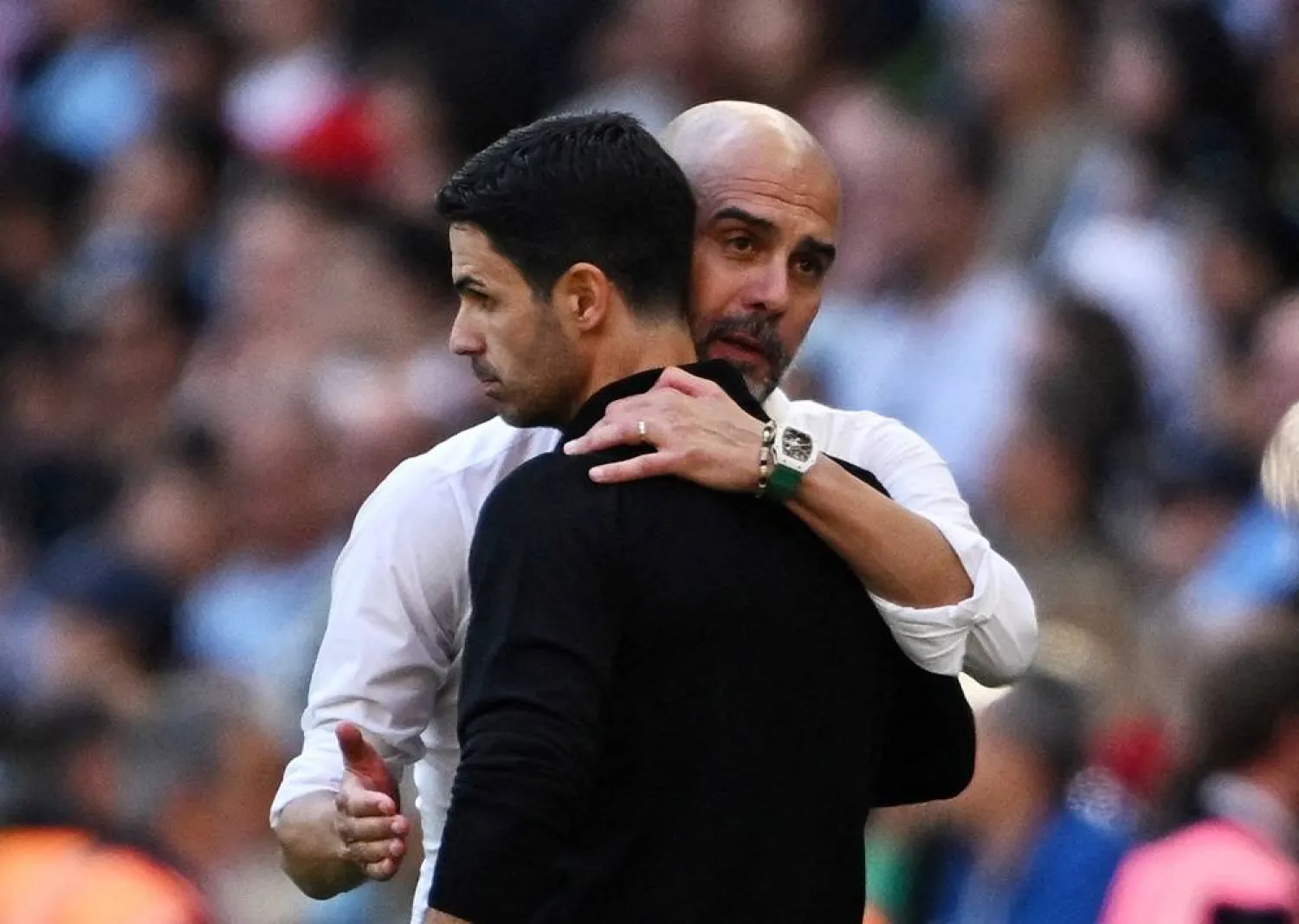 Football - Community Shield - Manchester City v Arsenal - Wembley Stadium, London, Britain - August 6, 2023 Manchester City manager Pep Guardiola with Arsenal manager Mikel Arteta at full time. (Reuters) 