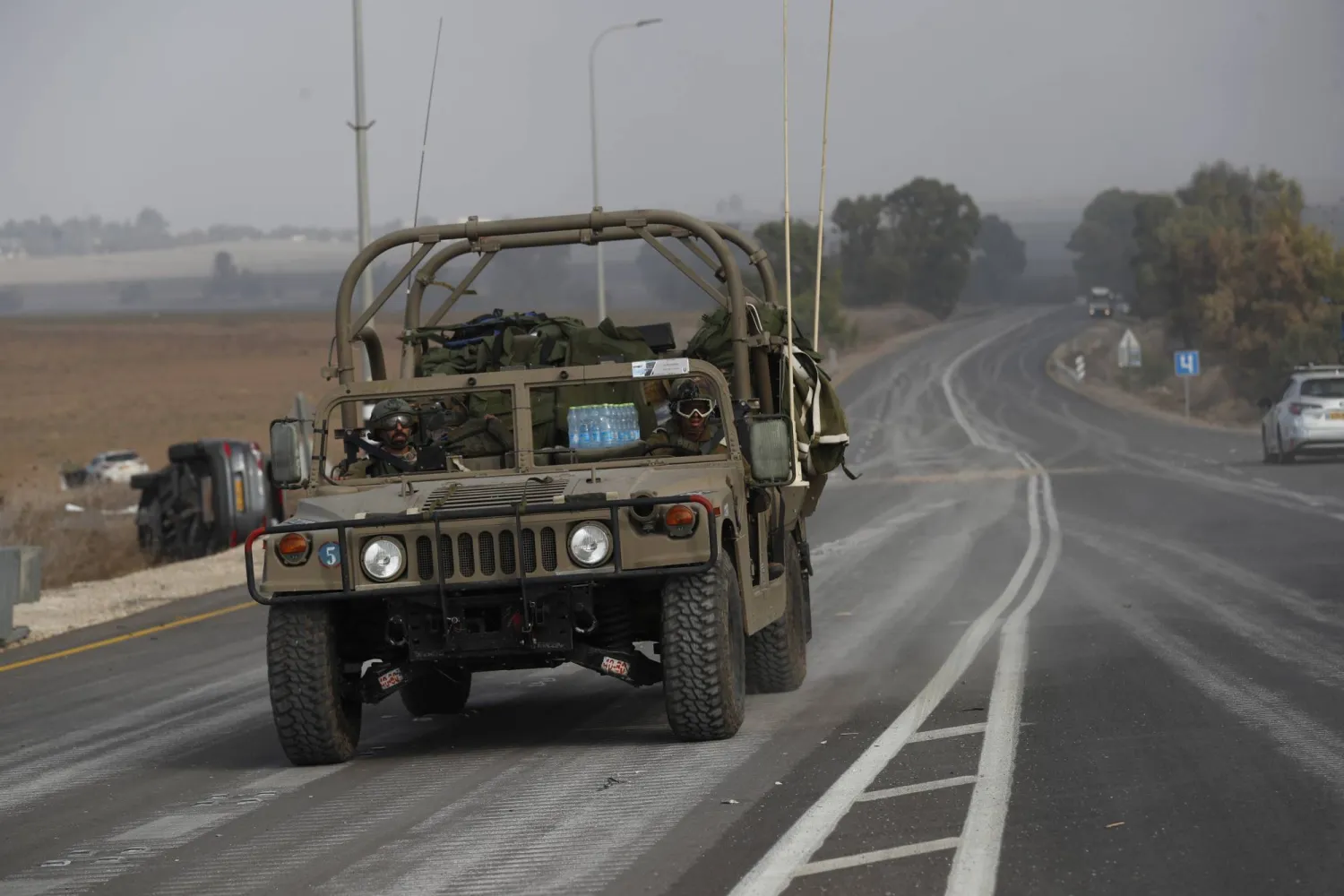 Israeli soldiers patrol on the roads near the border with Gaza, 08 October 2023. EPA/ATEF SAFADI