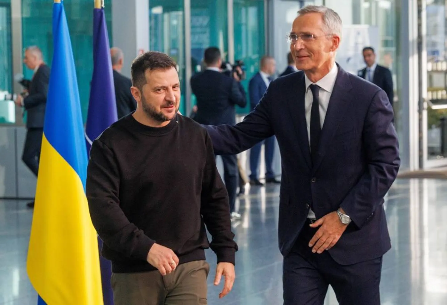 Ukraine's President Volodymyr Zelenskiy (L) is welcomed by NATO Secretary General Jens Stoltenberg at the start of his visit to the Alliance headquarters in Brussels, Belgium, 11 October 2023. (EPA)