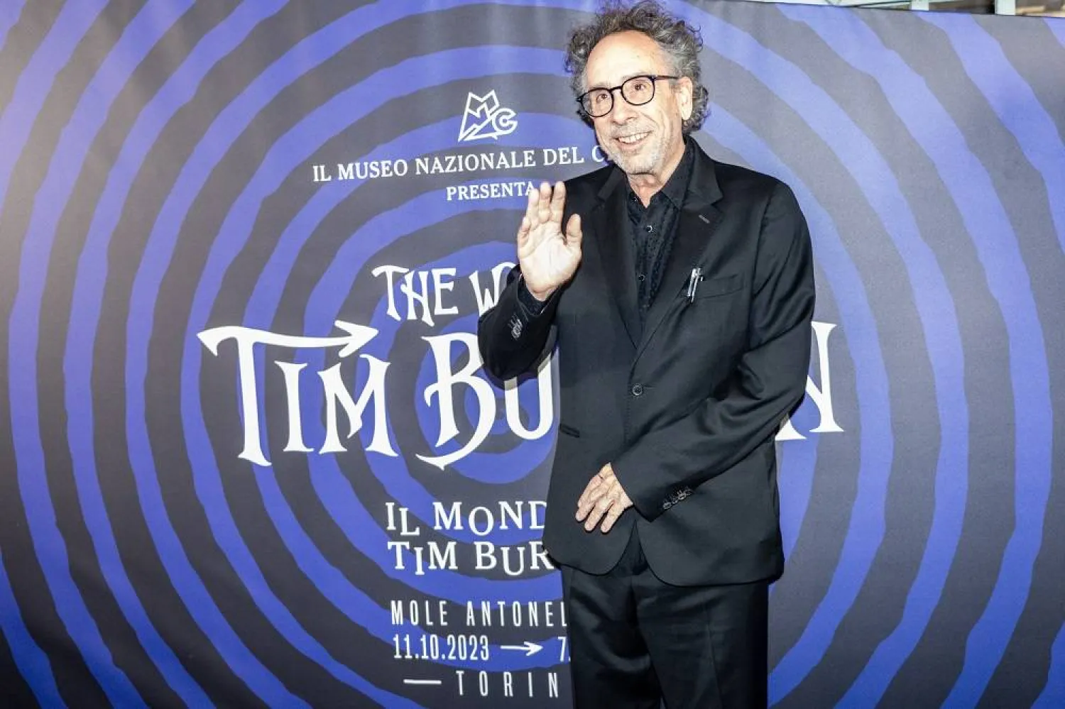 US filmmaker Tim Burton poses at the Mole Antonelliana landmark building in Turin, Italy, 10 October 2023, on occasion of the exhibition 'The World of Tim Burton'. Tim Burton will receive the Stella della Mole Award. (EPA)