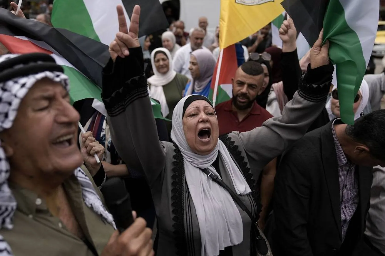  Palestinians attend a rally in support of Hamas and the Gaza Strip in the West Bank city of Nablus on Monday, Oct. 9, 2023. (AP)