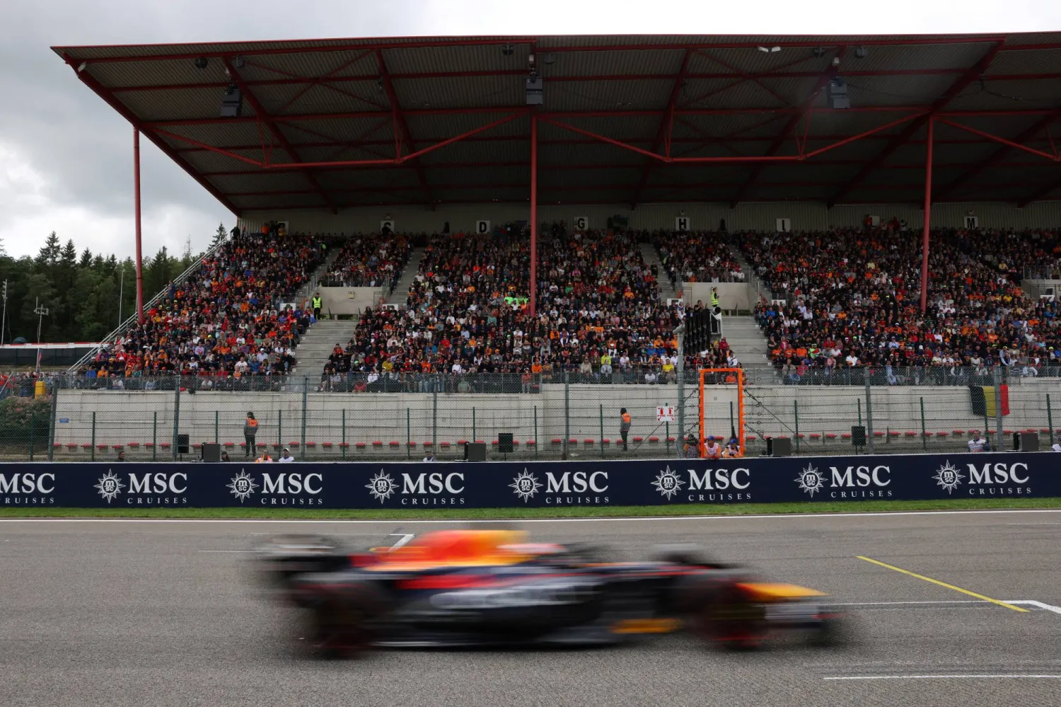FILE PHOTO: Formula One F1 - Belgian Grand Prix - Spa-Francorchamps, Spa, Belgium - July 30, 2023 General view of fans in the stand as Red Bull's Max Verstappen drives past during the race Pool via REUTERS/Simon Wohlfahrt/File Photo