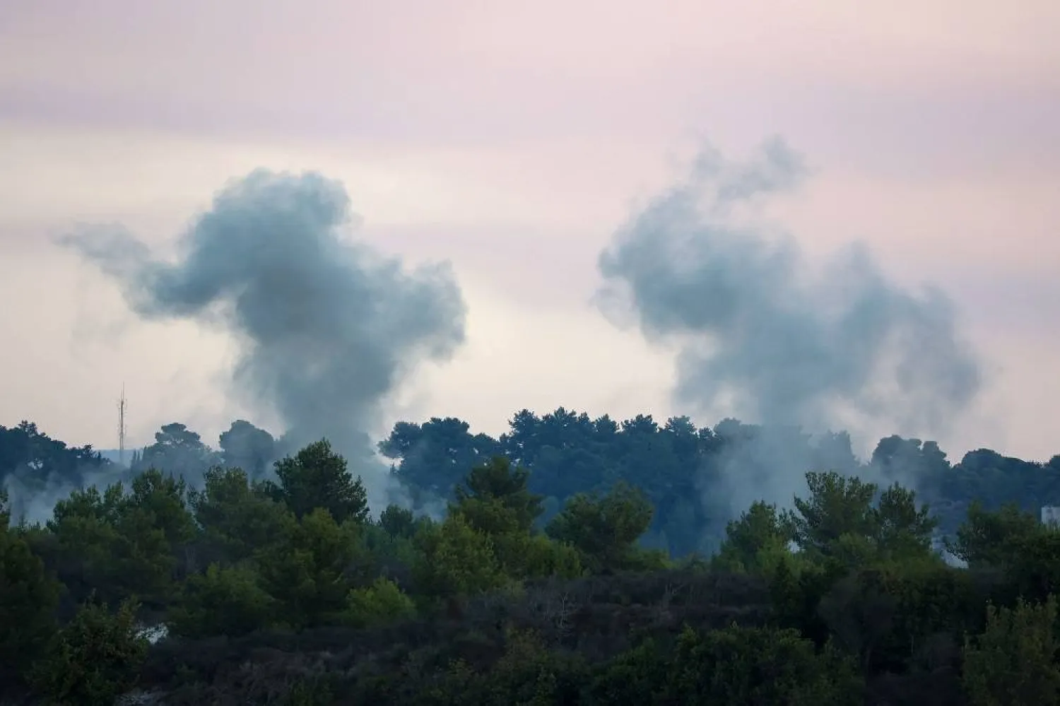 Smoke billows after an Israeli strike on the Lebanese village of Alma Al-Shaab on October 13, 2023. (AFP)