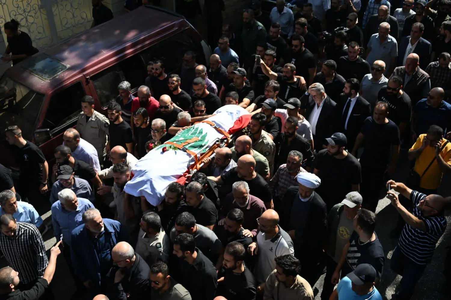 من تشييع الصحافي عصام عبد الله (الشرق الأوسط)