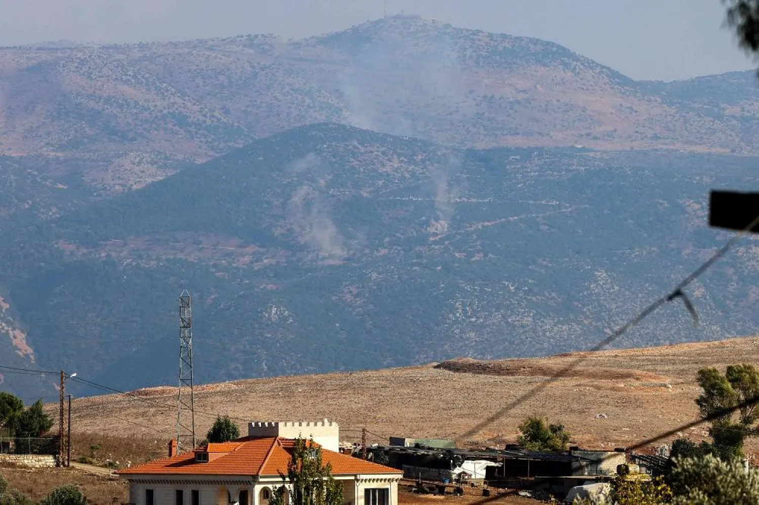 A picture taken from Lebanese town of Marjeyoun shows smoke billowing in the contested border area of Shebaa Farms on October 14, 2023, during a cross-border exchange between Lebanon and Israel. (AFP) 