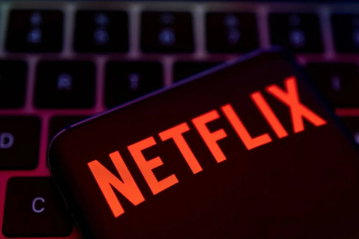 Smartphone with Netflix logo is placed on a keyboard in this illustration taken April 19, 2022. (Reuters)