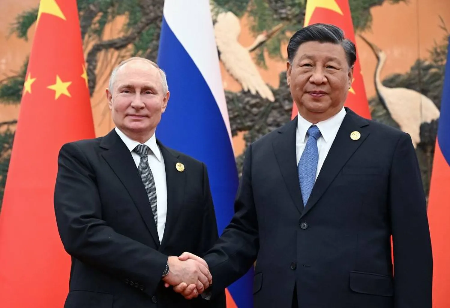 Russian President Vladimir Putin (L) and Chinese President Xi Jinping shake hands before their meeting as part of the 3rd Belt and Road Forum for International Cooperation, at the Great Hall of the People in Beijing, China, 18 October 2023. (EPA/Sputnik/Kremlin) 