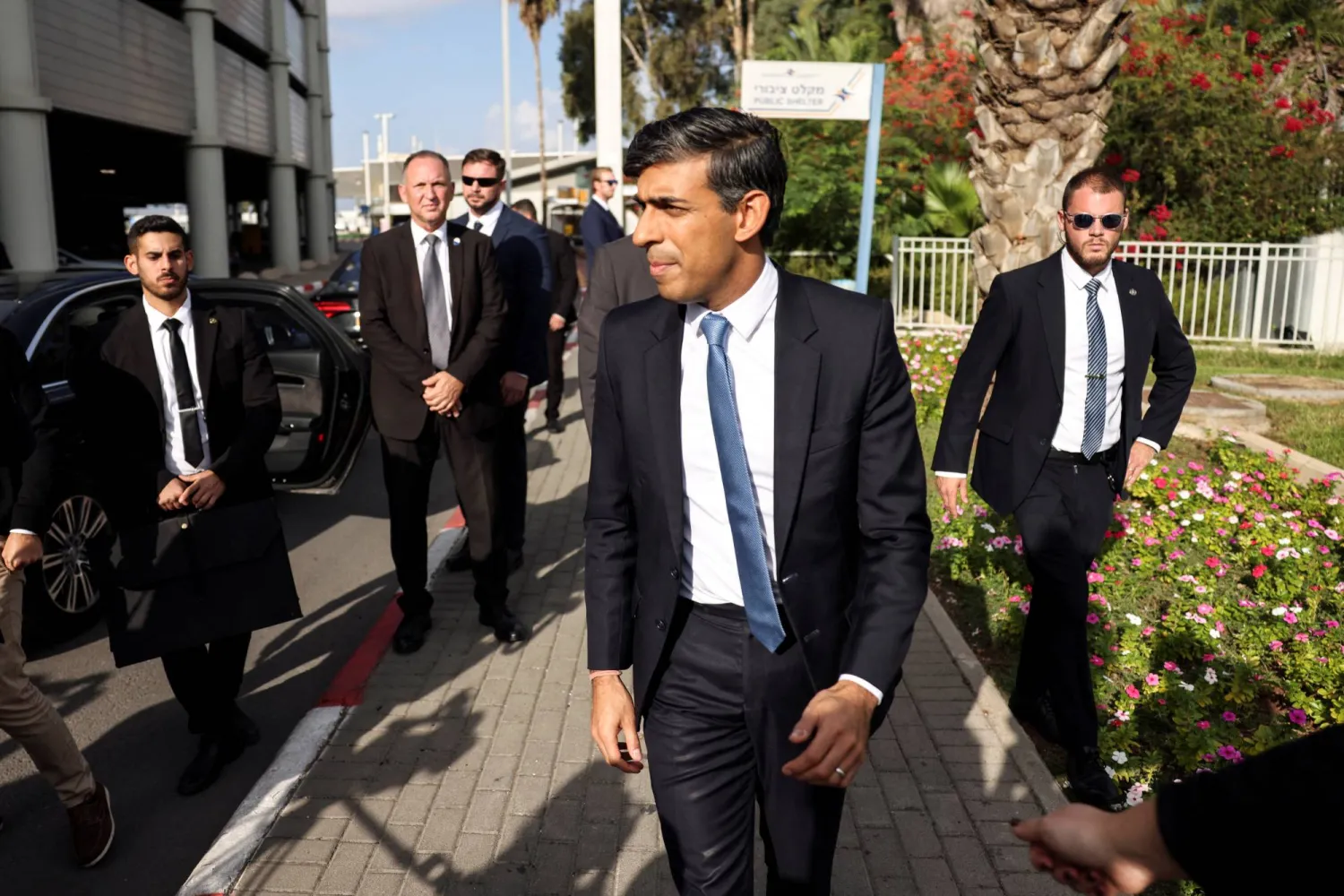 British Prime Minister Rishi Sunak walks after landing at Ben Gurion International Airport in Lod, Near Tel Aviv, Israel October 19, 2023. REUTERS/Ronen Zvulun